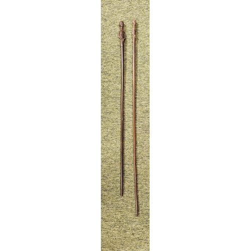 53 - 2 South African Hardwood walking canes the handle carved with a mans head and torso (L 89cm) and sim... 