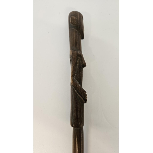 53 - 2 South African Hardwood walking canes the handle carved with a mans head and torso (L 89cm) and sim... 