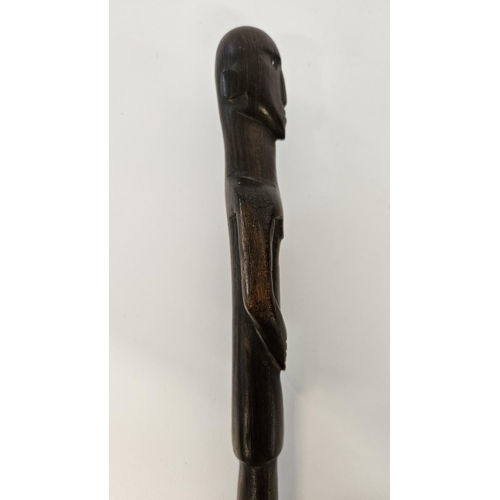 53 - 2 South African Hardwood walking canes the handle carved with a mans head and torso (L 89cm) and sim... 