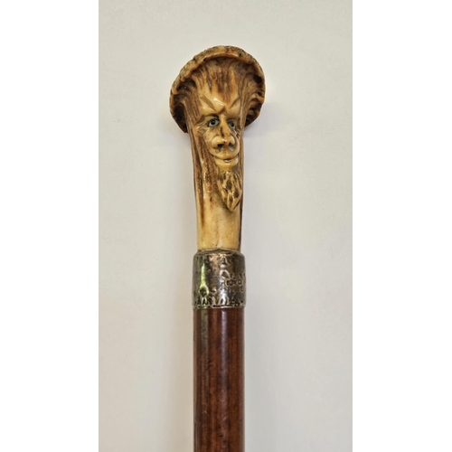 78 - 19thC Antler topped walking Cane with carved bearded face over Silver Collar and tapering fruitwood ... 