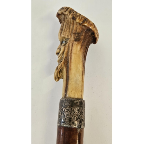 78 - 19thC Antler topped walking Cane with carved bearded face over Silver Collar and tapering fruitwood ... 