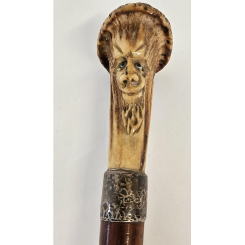 78 - 19thC Antler topped walking Cane with carved bearded face over Silver Collar and tapering fruitwood ... 