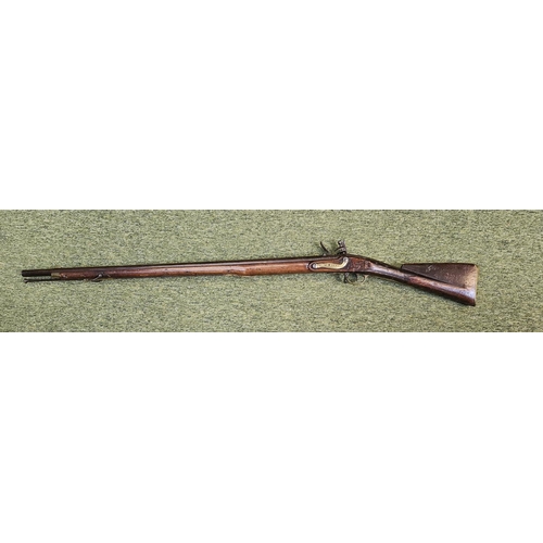 99 - An Early 19th flintlock musket rifle possible East Indian company, the action stamped, the walnut st... 