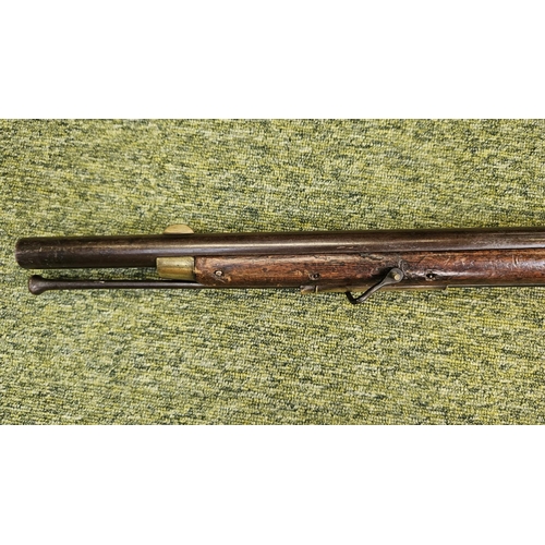 99 - An Early 19th flintlock musket rifle possible East Indian company, the action stamped, the walnut st... 