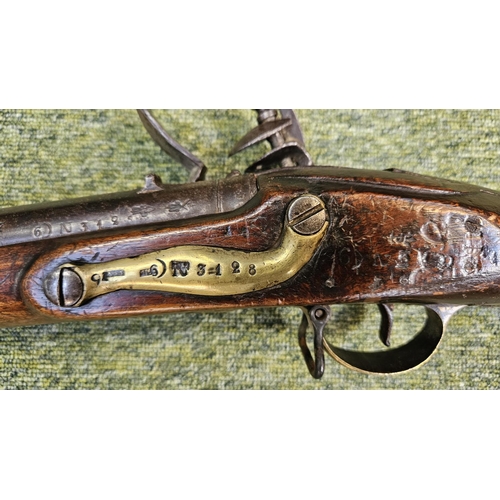 99 - An Early 19th flintlock musket rifle possible East Indian company, the action stamped, the walnut st... 