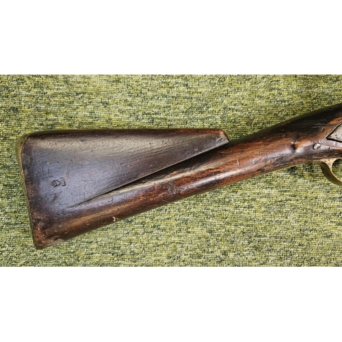 99 - An Early 19th flintlock musket rifle possible East Indian company, the action stamped, the walnut st... 