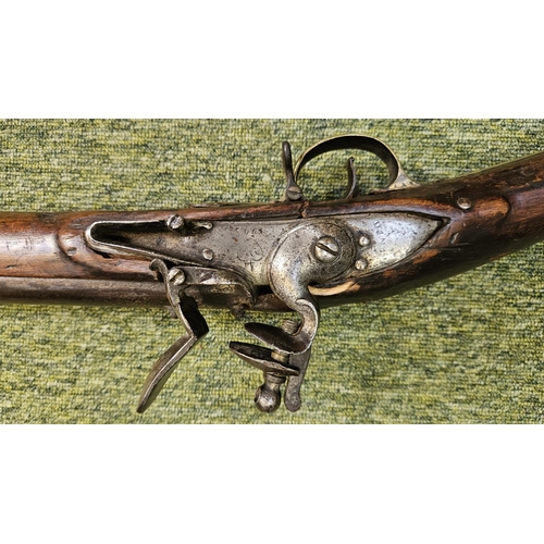 99 - An Early 19th flintlock musket rifle possible East Indian company, the action stamped, the walnut st... 