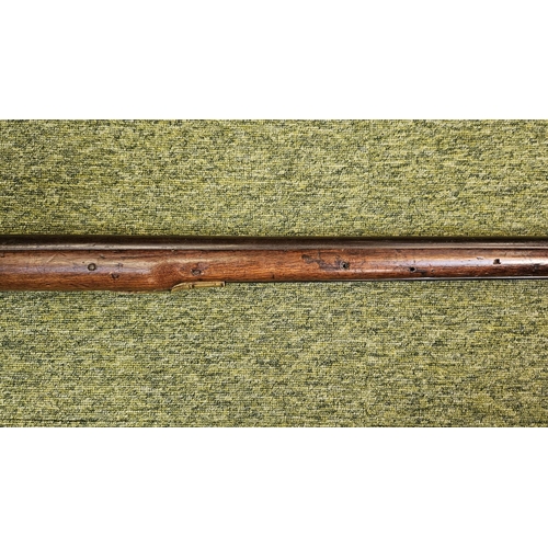 99 - An Early 19th flintlock musket rifle possible East Indian company, the action stamped, the walnut st... 