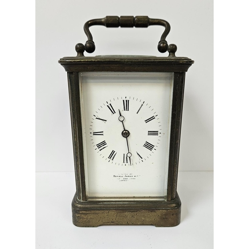 102 - Howell James of London Brass Carriage clock with roman numeral dial, complete with key. 16cm in Heig... 