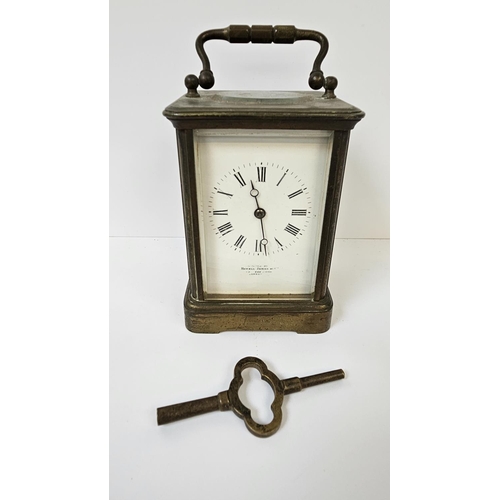 102 - Howell James of London Brass Carriage clock with roman numeral dial, complete with key. 16cm in Heig... 