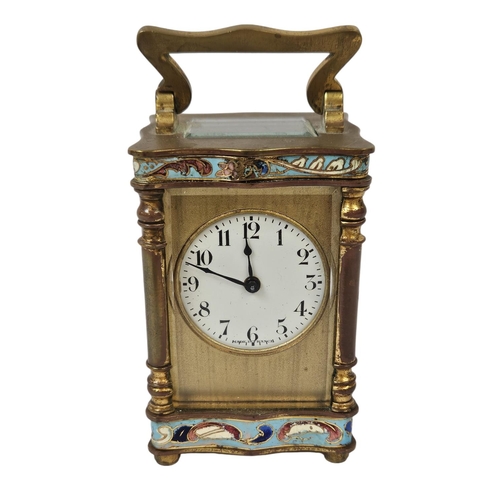 103 - A French Gilt Brass and Champleve enamel miniature carriage clock with enamel dial inscribed made in... 