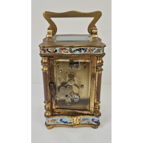 103 - A French Gilt Brass and Champleve enamel miniature carriage clock with enamel dial inscribed made in... 