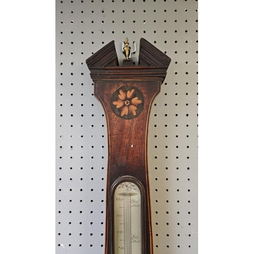 104B - A 19thC Anthony Gatty mahogany and marquetry wheel barometer, with silvered dials, the 8.5inch main ... 