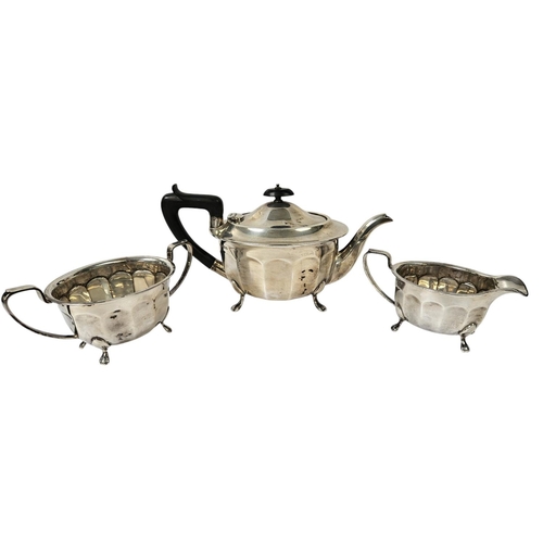 180 - Mid 20thC Silver 3 Piece Tea set with Ebony handle and knop supported on paw feet, Sheffield 1946. 9... 