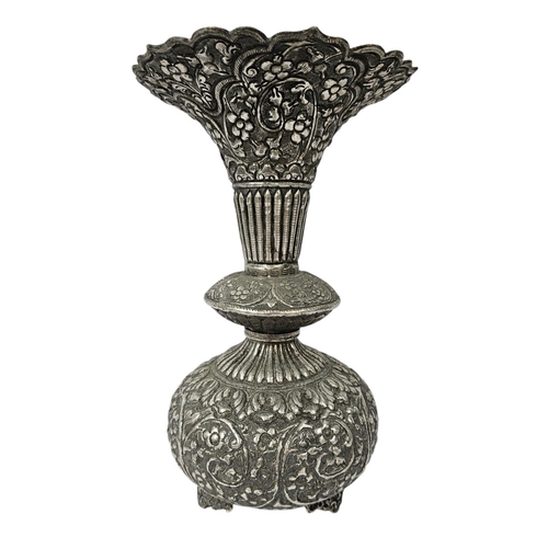 182 - Colonial Kutch Silver embossed vase with floral and fluted turned decoration supported on scroll fee... 