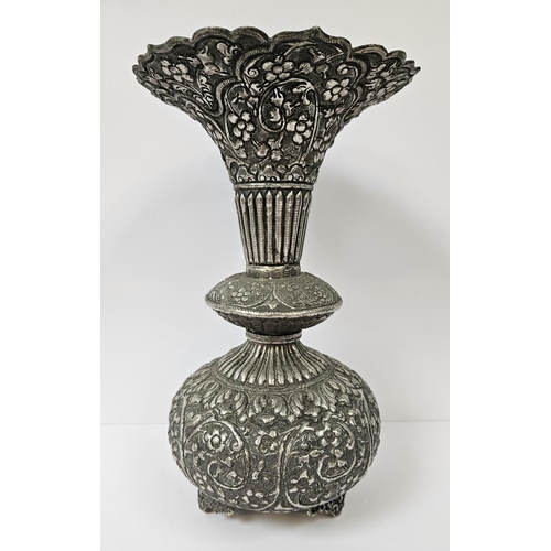 182 - Colonial Kutch Silver embossed vase with floral and fluted turned decoration supported on scroll fee... 