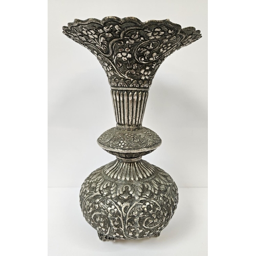 182 - Colonial Kutch Silver embossed vase with floral and fluted turned decoration supported on scroll fee... 