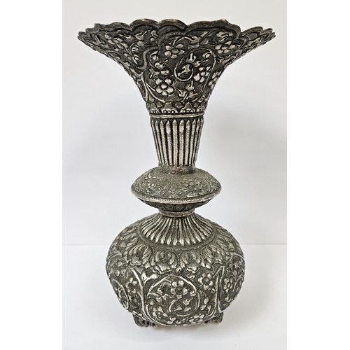 182 - Colonial Kutch Silver embossed vase with floral and fluted turned decoration supported on scroll fee... 