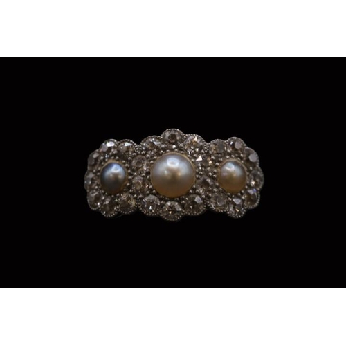 184 - Edwardian 18ct Gold Pearl and Diamond set ring, Set with 3 half Cut pearls surrounded by Facetted Di... 