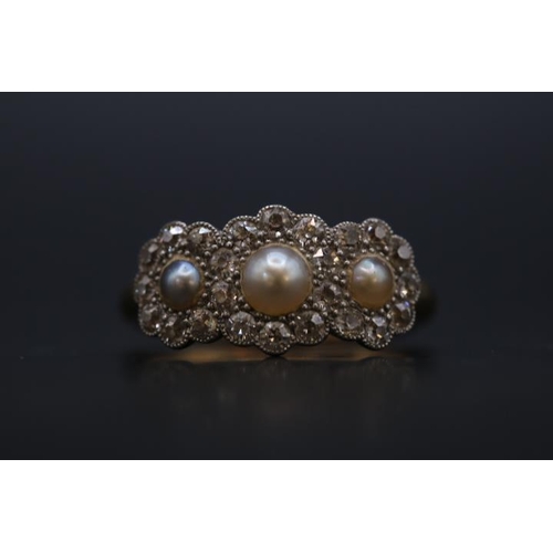 184 - Edwardian 18ct Gold Pearl and Diamond set ring, Set with 3 half Cut pearls surrounded by Facetted Di... 