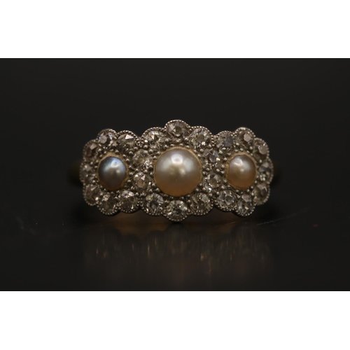 184 - Edwardian 18ct Gold Pearl and Diamond set ring, Set with 3 half Cut pearls surrounded by Facetted Di... 