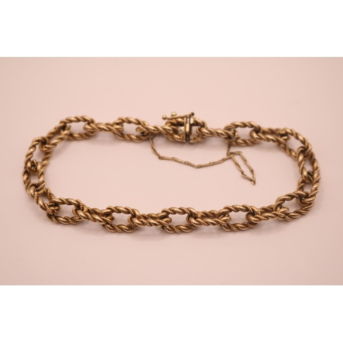 198 - 9ct Gold Imported Fancy twist chain link bracelet with sliding clasp and figure of eight catch with ... 