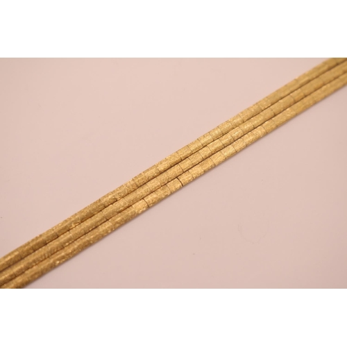 199 - 18ct Gold Ladies Tri strand bracelet with planished finish, marked 750. Sliding clasp and figure of ... 