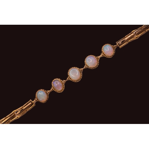 200 - Ladies 9ct Gold Moonstone set bracelet of 5 rub over set oval stones with expanding bracelet and saf... 