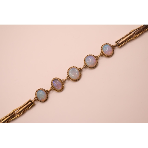 200 - Ladies 9ct Gold Moonstone set bracelet of 5 rub over set oval stones with expanding bracelet and saf... 