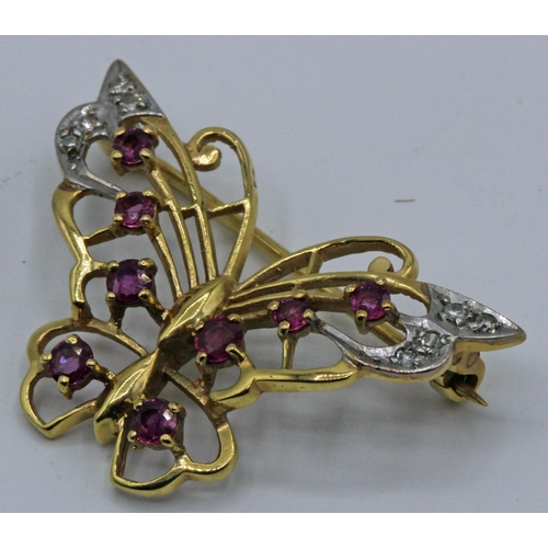 215 - 9ct Gold Diamond & Amethyst Butterfly Brooch 4.68gms. A beautiful 9ct gold butterfly brooch with 8 d... 