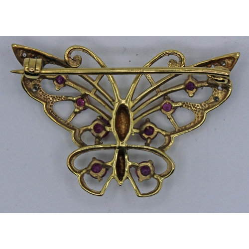 215 - 9ct Gold Diamond & Amethyst Butterfly Brooch 4.68gms. A beautiful 9ct gold butterfly brooch with 8 d... 