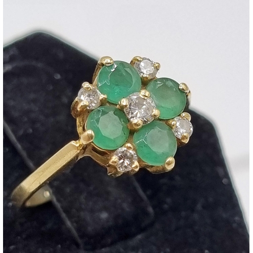 216 - 18ct Gold Diamonds & Green Emeralds Cavendish Ring 3.04gms. Five brilliant cut diamonds central diam... 