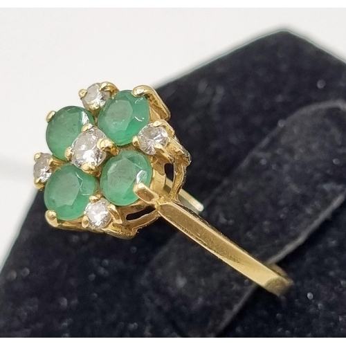 216 - 18ct Gold Diamonds & Green Emeralds Cavendish Ring 3.04gms. Five brilliant cut diamonds central diam... 