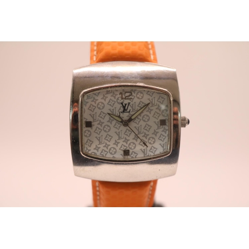 231 - Louis Vuitton of Paris Square faced wristwatch with curved case and removable padded orange strap. 3... 