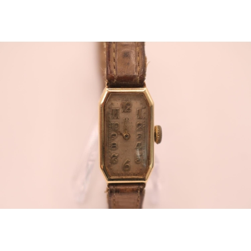 232 - 1930s Omega Ladies wristwatch with Numeral raised face and Silvered dial, engraved octagonal face. 1... 