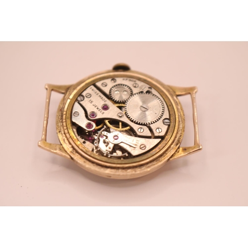 239 - 1930s 9ct Gold Gentlemen's circular faced wristwatch with numeral dial, 15 Jewel marked KF300. 30mm ... 