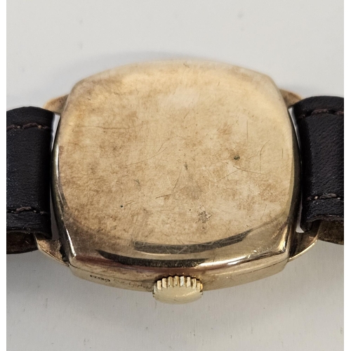 241 - Rolex Tudor 9ct Gold Hand winding wristwatch with numeral dial in cushion shaped case. 26mm case.