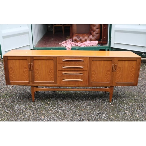 311 - G Plan Mid Century Teak Low sideboard of 4 drawers flanked by double cupboards with cup handles and ... 