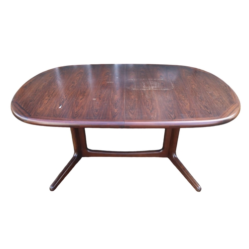 323 - Danish Edvard Valenstinsen Rosewood Dining table of oval form with 2 extra leaves over single suppor... 