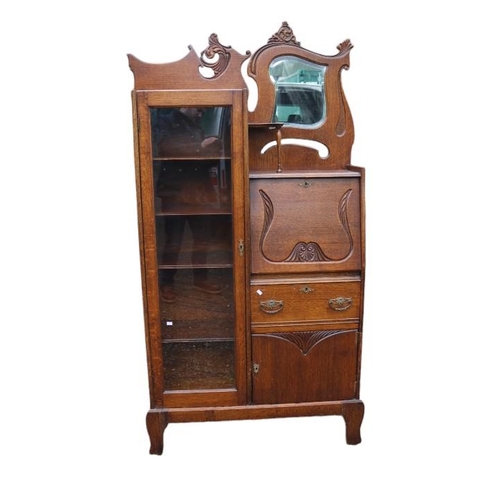 341 - Art Nouveau Oak fall front bureau bookcase with glazed front and brass handles, mirror to top with c... 