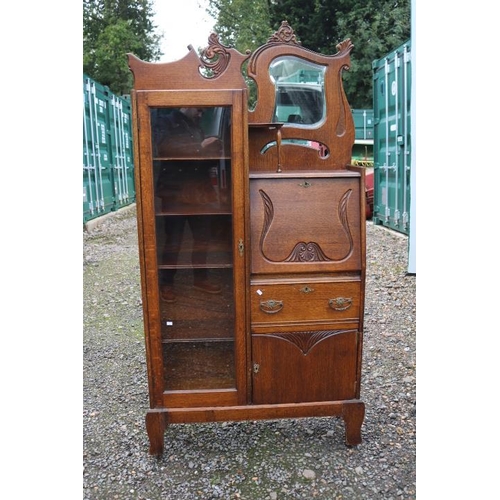 341 - Art Nouveau Oak fall front bureau bookcase with glazed front and brass handles, mirror to top with c... 