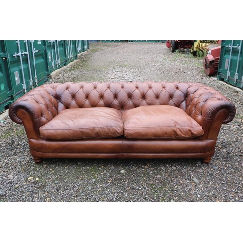 342 - Good Quality 20thC Brown Leather Chesterfield 2 seater sofa with scroll arms above turned feet. 216c... 