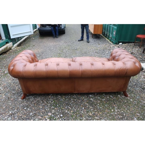 342 - Good Quality 20thC Brown Leather Chesterfield 2 seater sofa with scroll arms above turned feet. 216c... 