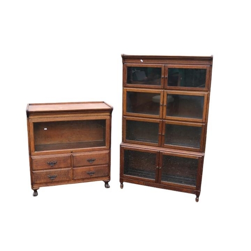 346 - Henry Hammer & Sons Globe-Wernicke style sectional glazed bookcase with 4 drawers to base and paw fe... 