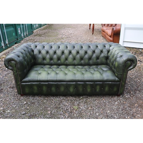 349 - 20thC Green Leather Chesterfield Sofa with button back and brass stud decoration and applied turned ... 