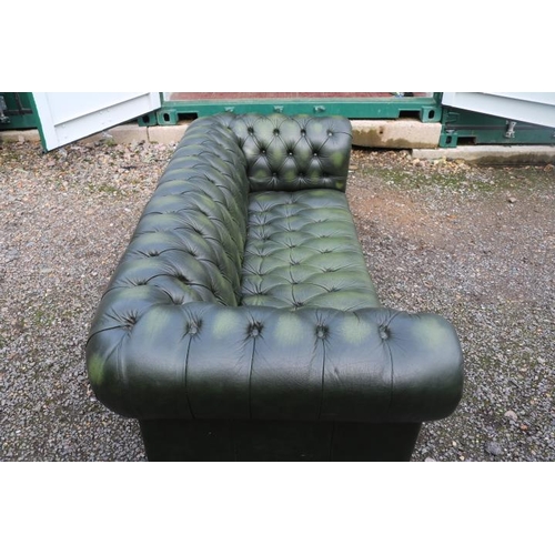 349 - 20thC Green Leather Chesterfield Sofa with button back and brass stud decoration and applied turned ... 