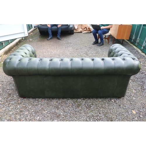 349 - 20thC Green Leather Chesterfield Sofa with button back and brass stud decoration and applied turned ... 