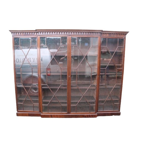 353 - Victorian Mahogany Breakfront Astragal glazed triple bookcase with moulded fretwork on stepped base.... 