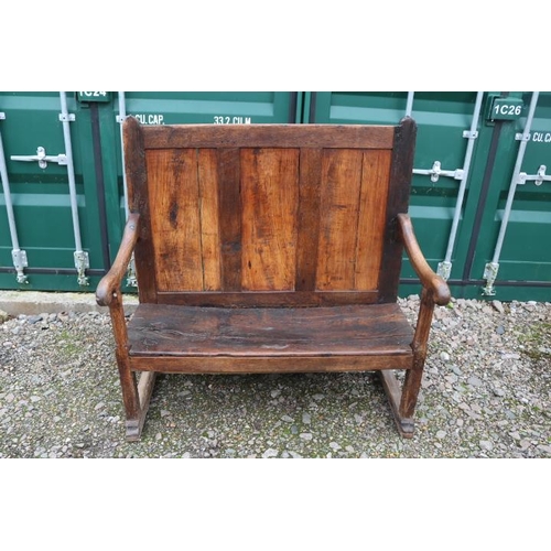 355 - 18thC Elm vernacular settle with high raised panel back and curved elbows. 122cm in Width by 56cm in... 