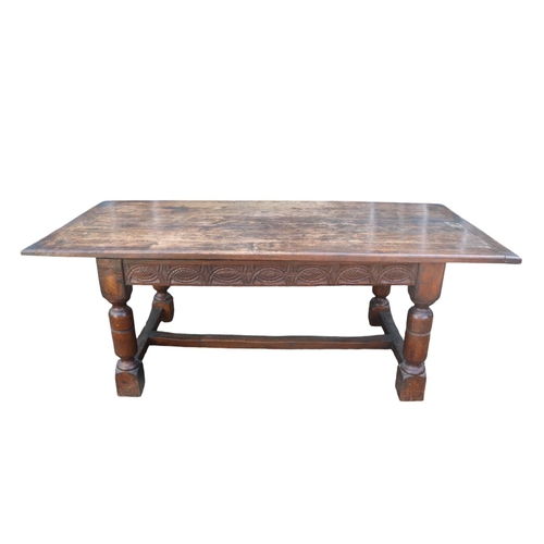 361 - 19thC Jacobian style Refectory table with plank top above carved frieze and 4 turned legs and straig... 